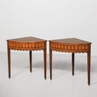 A pair of mahogany, satinwood, fruitwood and marquetry corner tables