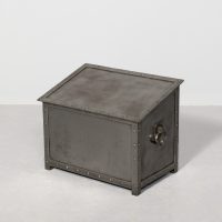 An Arts &amp; Crafts Sloping Polished Steel Log Bin