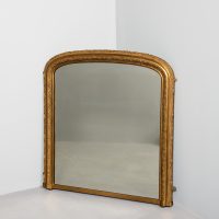 Mid-Victorian neat-sized arched gilded wall or overmantel mirror with original mirror plates