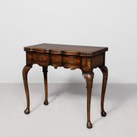 Early Georgian-style, crossbanded figured-walnut fold-over game tables