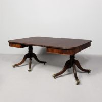 A Regency Mahogany Twin Pillar Dining Table and Extra Leaf.