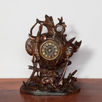 Carved walnut Black Forest mantel clock