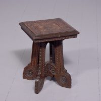 Art Nouveau or Arts and Crafts carved oak occasional table