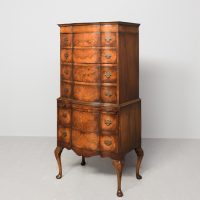 George II style burr walnut serpentine front chest on stand