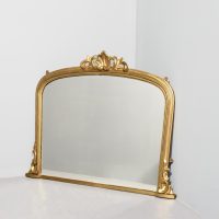 Mid Victorian arched giltwood overmantel mirror with original water gilding