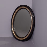 19th Century ebonized and gilded oval hall mirror, possibly Irish