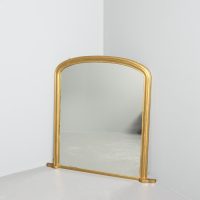 Mid-Victorian arched gilded overmantel mirror with original mirror plate, traditionally restored.