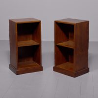 A quality pair of teak open bedside cabinets