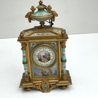 FRENCH MANTEL CLOCK WITH SERVES PANELS
