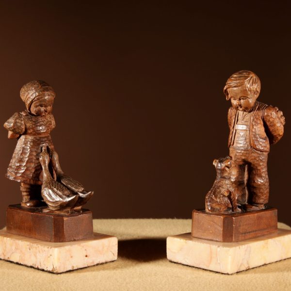 Black Forest Original Pair Of Fine carved Sculptures Of A Boy And Girl.