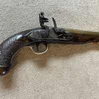 A brass barrelled flintlock pistol by Blake London