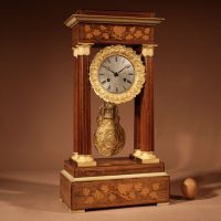 A Very Interesting And Rare Stylish Rosewood fine Inlaid With Lemon Wood and Ormolu Portico Clock Circa: 1840