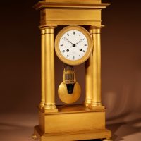 Interesting French Charles X Very Fine Original Gilded Portico Clock Circa 1830.