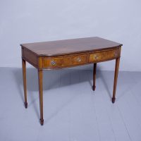 A George III style mahogany and inlaid bow fronted side table