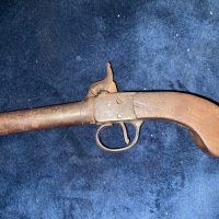 Pistol percussion pocket.