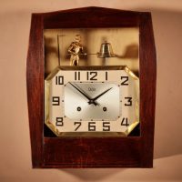 A French Art Deco Oak Signed Odo Automation Striking Wall Clock.
