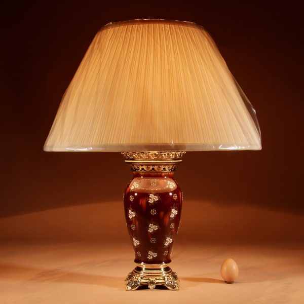 A French Ceramic And Brass Table Lamp. 