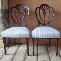 Pair of mahogany side chairs by Holland and Sons