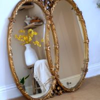 Vintage mpressive Gilded Double-Oval Statement Mirror.
