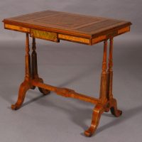 Regency revival walnut and specimen woods rectangular stretcher table.