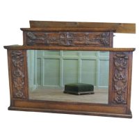 A Large Arts and Crafts Carved Oak Overmantel or Wall Mirror