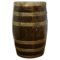 A Large Brass and Oak Barrel Stick Stand This good looking piece