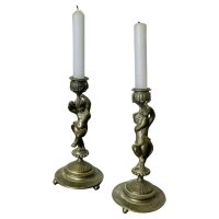 A Pair of 19th Century Brass Candle Sticks with Dancing Cherubs