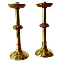 A Pair of Arts and Crafts Brass Candle Sticks