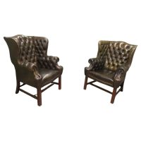 A Pair of Georgian Style Gentleman’s Wing Back Leather Chesterfield Chairs
