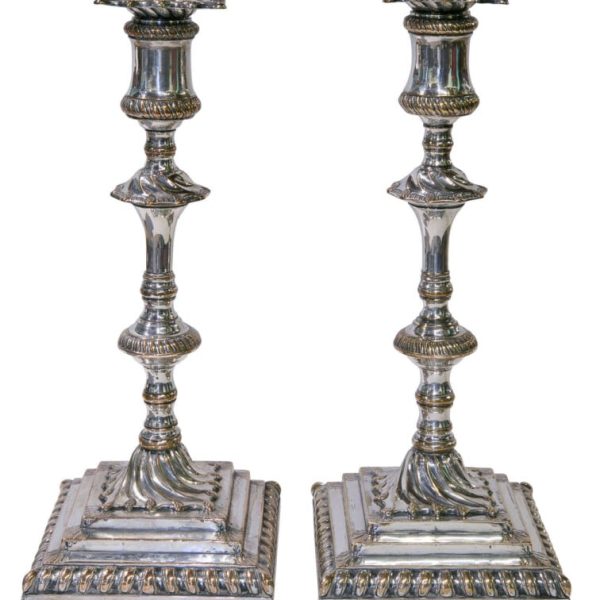 A superb pair of square based candlesticks