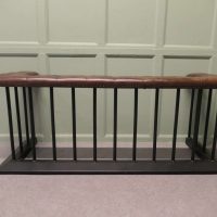 A Wrought Iron and Leather Fire Side Seat, Club Fender This is a grand piece
