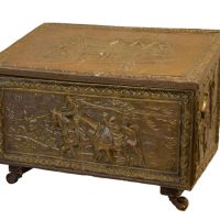 An embossed brass log/coal box