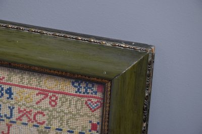 Victorian framed wool-work embroidered sampler retaining a good colour - Image 2