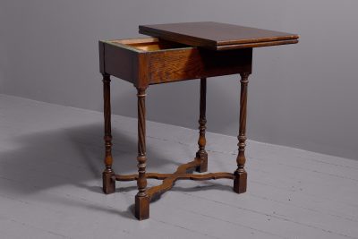 Neat-sized Jacobean-style, oak side table/fold-over games table - Image 8